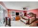 Bedroom with a large bed, flat screen TV, and pink walls at 7619 Woodknoll Dr, Charlotte, NC 28217