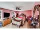 Spacious bedroom with red walls and a plush bed at 7619 Woodknoll Dr, Charlotte, NC 28217