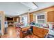 Functional kitchen with oak cabinets, island, and adjacent dining area at 7619 Woodknoll Dr, Charlotte, NC 28217