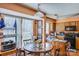 Bright dining area featuring hardwood floors, and view of the kitchen and eating area at 7619 Woodknoll Dr, Charlotte, NC 28217