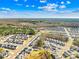 Aerial view of houses in a Charlotte, NC neighborhood with tree coverage at 8005 Rolling Wheels Rd, Charlotte, NC 28215