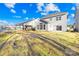 This backyard is spacious and open, and contains the rear exterior of the home at 8005 Rolling Wheels Rd, Charlotte, NC 28215