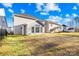 Large backyard area showing the lawn and the rear exterior of the home at 8005 Rolling Wheels Rd, Charlotte, NC 28215