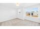 Bright bedroom featuring neutral carpet, two windows allowing for natural light, and ceiling light fixture at 8005 Rolling Wheels Rd, Charlotte, NC 28215