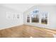 Inviting bedroom with a large window offering natural light and hardwood floors at 8005 Rolling Wheels Rd, Charlotte, NC 28215