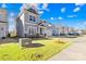 This two-story home features a lush green lawn and is nestled in a Gathering-friendly neighborhood at 8005 Rolling Wheels Rd, Charlotte, NC 28215