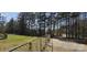 Large backyard with a chainlink fence and a wooded area, giving plenty of room for outdoor activities at 816 Osteen Rd, York, SC 29745