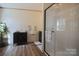 Bright bathroom featuring a glass shower and sleek black vanity at 816 Osteen Rd, York, SC 29745