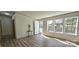 Light-filled living room with wood-look flooring and an entryway with large windows at 816 Osteen Rd, York, SC 29745