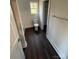 Bathroom featuring a commode, tile floors, and a walk-in closet with shelves at 8704 Moody Rd, Charlotte, NC 28215