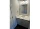 Bathroom features a modern vanity with a mirror, and recessed lighting at 8704 Moody Rd, Charlotte, NC 28215