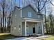 Charming two-story home features a covered porch, vinyl siding, and a well-manicured lawn surrounded by mature trees at 8704 Moody Rd, Charlotte, NC 28215