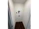 A laundry room with hookups and a dark wood floor at 8704 Moody Rd, Charlotte, NC 28215