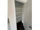 Pantry with built in shelving and dark hardwood flooring at 8704 Moody Rd, Charlotte, NC 28215