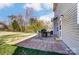 Backyard patio with outdoor dining set and lush greenery, perfect for entertaining at 100 Marabou Ct, Mount Holly, NC 28120