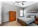 Bedroom featuring a wooden bed, closet, ceiling fan, and bright window at 100 Marabou Ct, Mount Holly, NC 28120