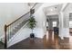 Grand foyer featuring hardwood floors, a staircase, and an open layout at 100 Marabou Ct, Mount Holly, NC 28120