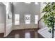 Light-filled entryway with high ceilings, wainscoting, and a decorative front door at 100 Marabou Ct, Mount Holly, NC 28120