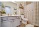 Bright bathroom with a vanity, ample counter space, and decorative accents at 10202 Little Whiteoak Rd, Charlotte, NC 28215