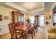 Elegant dining room with a large wooden table and an ornate hutch, perfect for entertaining at 10202 Little Whiteoak Rd, Charlotte, NC 28215