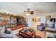 Living room with TV, ceiling fan and decorative wood accents at 10202 Little Whiteoak Rd, Charlotte, NC 28215