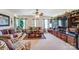 Living room featuring couches, coffee table and a wooden entertainment center at 10202 Little Whiteoak Rd, Charlotte, NC 28215