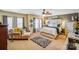 A large primary bedroom offers comfortable seating and bright window lighting at 10202 Little Whiteoak Rd, Charlotte, NC 28215