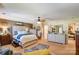 Spacious main bedroom features a ceiling fan and coordinated furniture at 10202 Little Whiteoak Rd, Charlotte, NC 28215