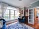 Bright living room showcasing a large window, hardwood floors, and a classic wood cabinet at 120 Shadow Ridge Ct, Statesville, NC 28677