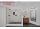 Modern bathroom featuring a tiled shower, wood vanity, and sleek black fixtures at 1426 Doe Ridge Ln, Fort Mill, SC 29715