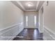 Bright entryway featuring wood-look floors, decorative wainscoting, and a tray ceiling at 1453 Ardmore Dr # 240, Sherrills Ford, NC 28673