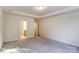 Carpeted main bedroom featuring a trey ceiling and an ensuite bath at 1453 Ardmore Dr # 240, Sherrills Ford, NC 28673