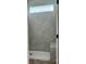 Walk-in shower with gray tile and a built-in bench, offering a spa-like experience at 1453 Ardmore Dr # 240, Sherrills Ford, NC 28673