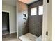 Shower with dark, modern tiling and convenient inset shelf at 1453 Ardmore Dr # 240, Sherrills Ford, NC 28673