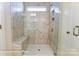 Beautiful walk-in shower boasts marble-look tiles, built-in bench, and window for natural light at 1453 Ardmore Dr # 240, Sherrills Ford, NC 28673