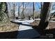 Backyard featuring a deck area with patio furniture, perfect for outdoor relaxation and entertainment at 1793 Fairway Dr, Newton, NC 28658