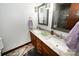 Bathroom with a double sink vanity, framed mirrors, and stylish light fixtures at 1793 Fairway Dr, Newton, NC 28658