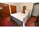 Bedroom featuring a wooden bed frame and warm carpet at 1793 Fairway Dr, Newton, NC 28658