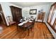 Formal dining room featuring hardwood floors, ample lighting, and a large dining table set for a meal at 1793 Fairway Dr, Newton, NC 28658