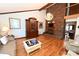 Bright living room showcases hardwood floors, a fireplace, and a decorative chandelier at 1793 Fairway Dr, Newton, NC 28658