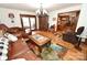 Spacious living room with hardwood floors, a large rug, comfortable seating, and natural light at 1793 Fairway Dr, Newton, NC 28658