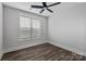 Bedroom with hardwood flooring, neutral walls, a ceiling fan, and window at 2081 Fordhill St, Rock Hill, SC 29732