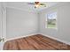 Bedroom with hardwood floors, neutral walls, a ceiling fan and natural light from the window at 2082 Egret Ct, Rock Hill, SC 29732