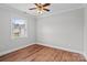 Bedroom with hardwood floors, neutral walls and ceiling fan, plus natural light from the window at 2082 Egret Ct, Rock Hill, SC 29732