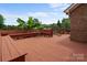 Wide angle shot of a large deck featuring bench seating and a view of the wooded back yard at 2082 Egret Ct, Rock Hill, SC 29732