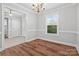 Elegant dining room with hardwood floors, crown molding, and a view into the entryway at 2082 Egret Ct, Rock Hill, SC 29732