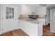 Bright kitchen with white cabinetry, stainless steel appliances, and a granite countertop island at 2082 Egret Ct, Rock Hill, SC 29732