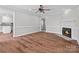 Bright living room with wood floors, a fireplace, and views into other rooms at 2082 Egret Ct, Rock Hill, SC 29732