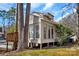 Back of the house with a wooden porch and an outdoor area at 2406 Brook Canyon Dr, Charlotte, NC 28212