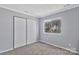 Bedroom featuring a closet and a window at 2406 Brook Canyon Dr, Charlotte, NC 28212